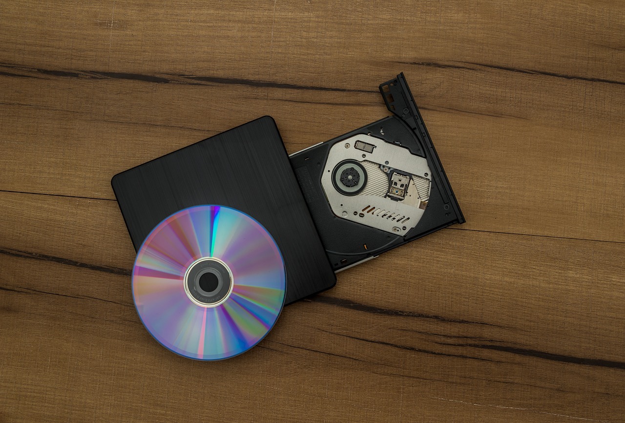 Compact Disc on top of a CD burner