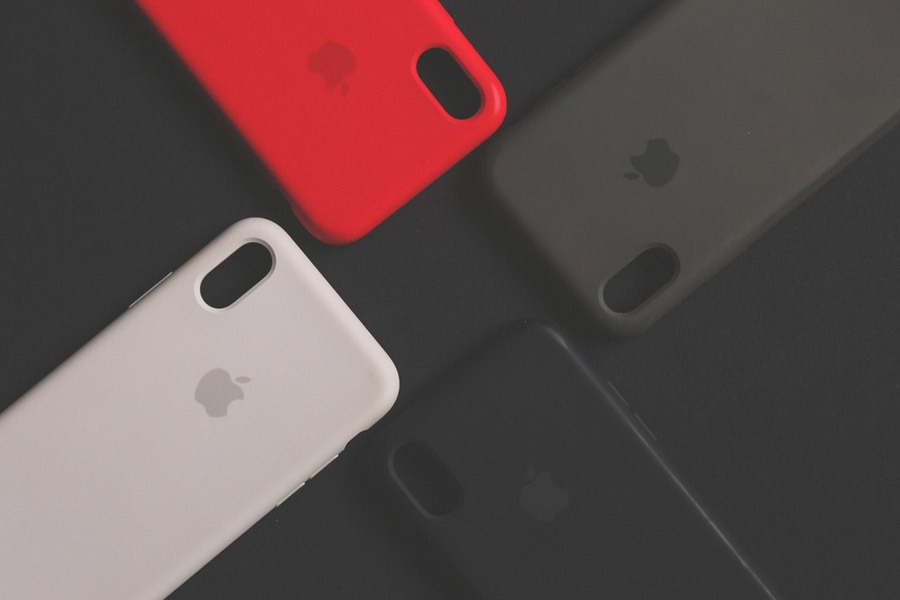 Different colors of apple phone case in black canvas