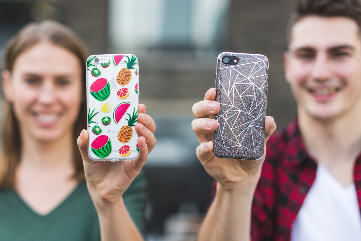 two people showing of their cute phone cases