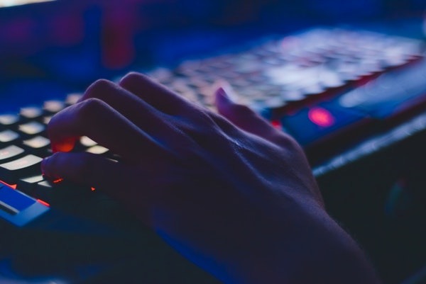 Photo of a hand on a keyboard