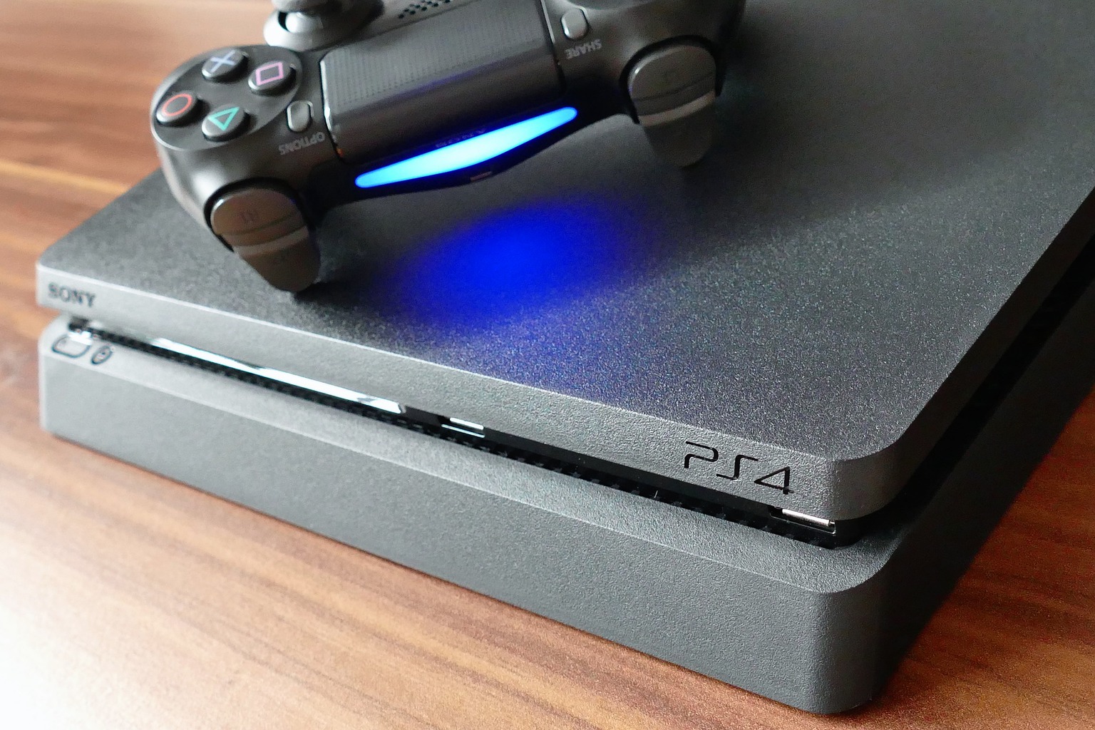 A controller and PS4 that could benefit from cooling stands